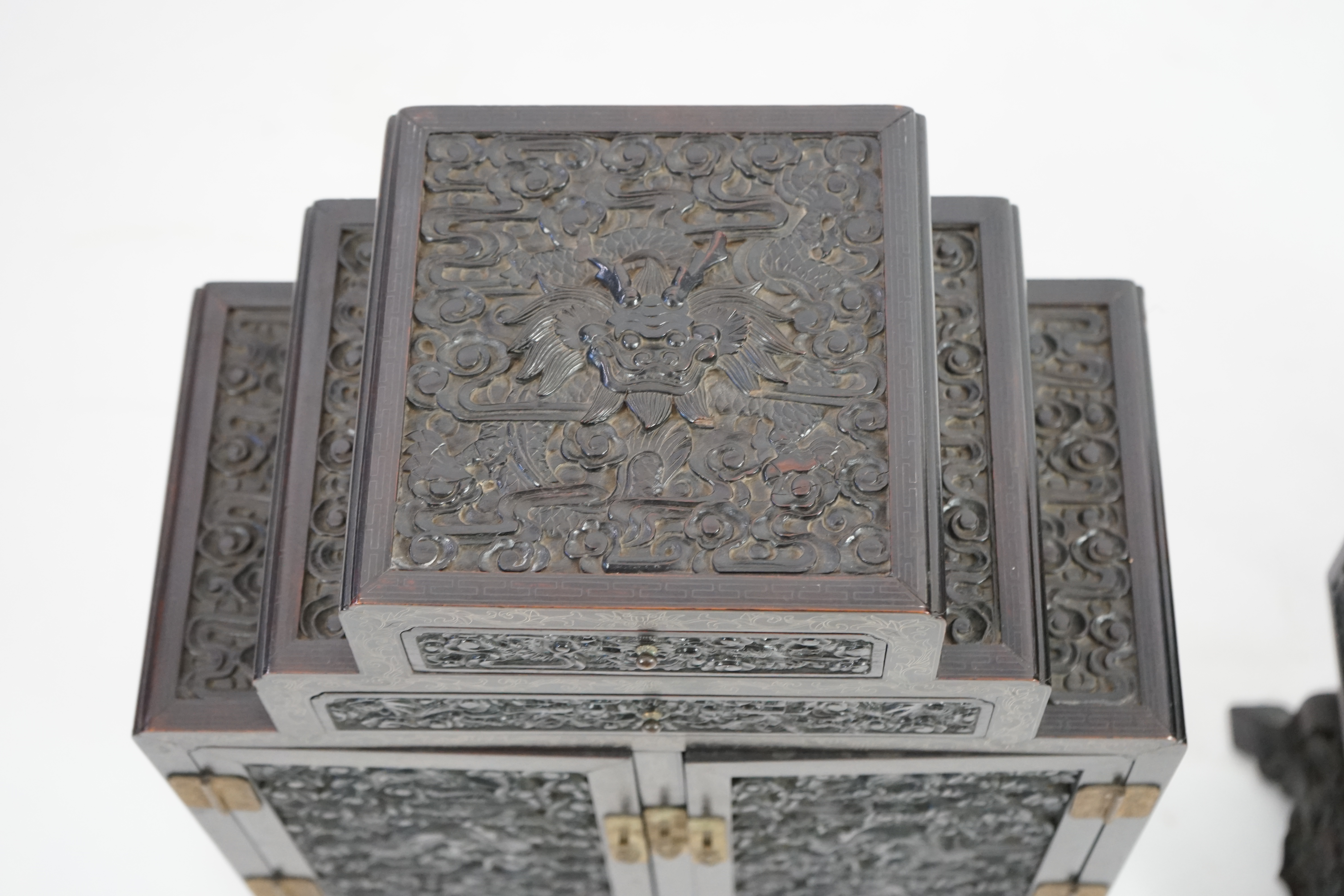 An important pair of Chinese carved zitan and silver wire inlaid ‘cloud and dragon’ curio cabinets and stands, duobaoge, probably Imperial, late Qing dynasty